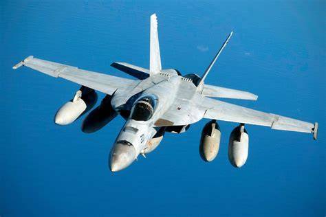 F/A-18 Super Hornet with full weapons load and enhanced airbrake system