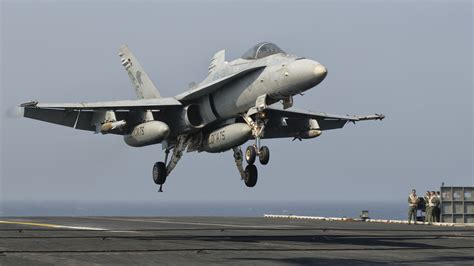 F/A-18C landing on aircraft carrier, tailhook deployed