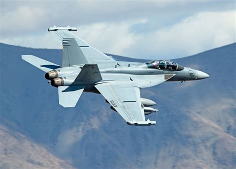 F/A-18F refueling an EA-18G Growler over an aircraft carrier
