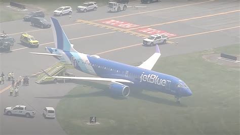 FAA and NTSB officials inspecting JetBlue A220-300 at BOS crash site