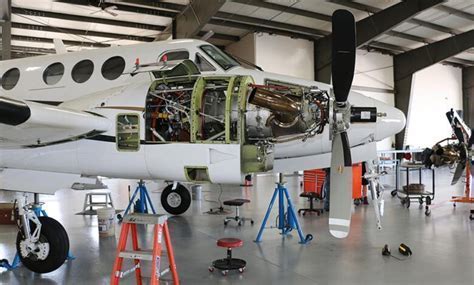 FAA maintenance crew conducting annual inspection to maintain airworthiness compliance