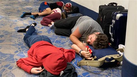 families sleeping on airport floor amid delays and cancellations
