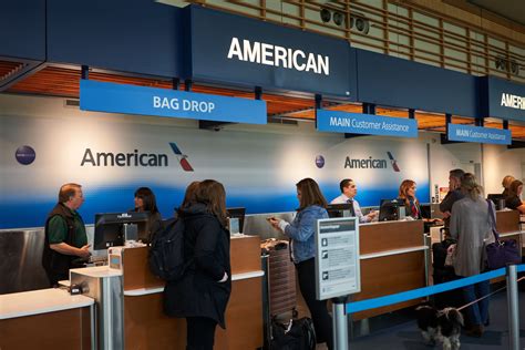 Family checking in at United Airlines airport counter using MileagePlus pooling
