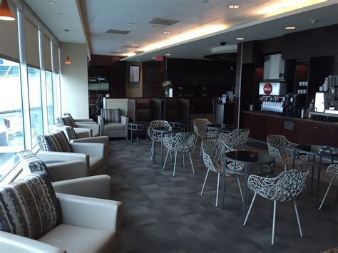 family travelers relaxing inside alaska lounge at pdx