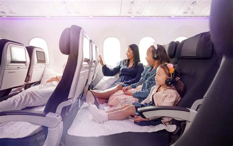 family using Air New Zealand Economy Skycouch with toddler
