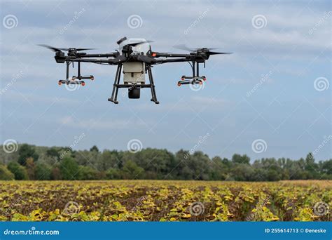 farmer using DJI Agras drone for crop spraying in New Jersey field