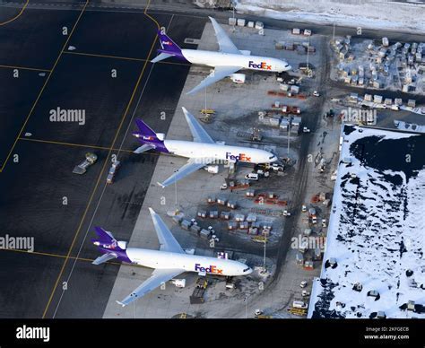 FedEx and DHL cargo aircraft at Kansai International Airport cargo ramp