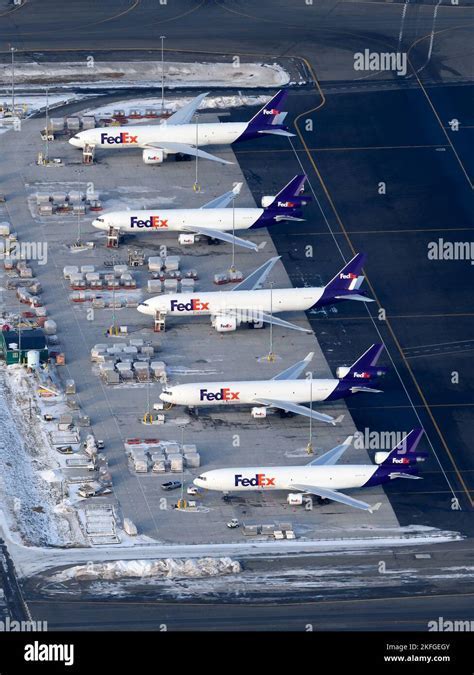 FedEx cargo aircraft loading at Piedmont Triad International Airport apron