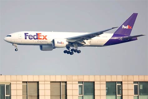 FedEx cargo aircraft on tarmac at night