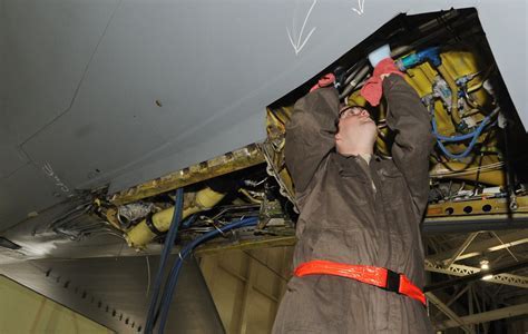 fedex certified mechanic checking aircraft hydraulic systems