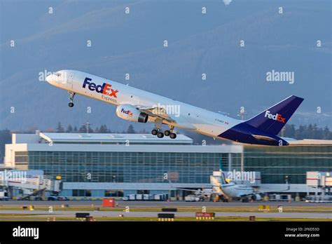 FedEx Express Boeing 757 freighter loading cargo containers