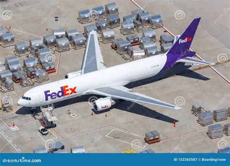 FedEx Express Boeing 767-300F loading cargo at night hub
