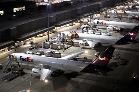 FedEx Express SuperHub cargo aircraft parked at Memphis International Airport before overnight sortation