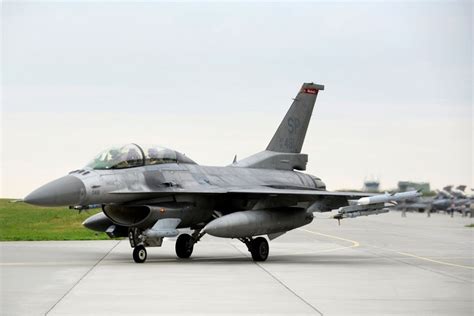 Fetești Air Base runway with F-16s lined up under NATO flag