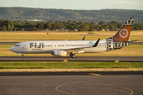 fiji airways aircraft flying over pacific ocean