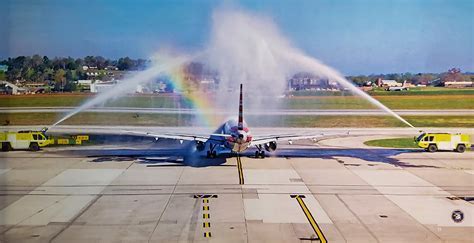 final swoop flight aircraft receiving water cannon salute on runway