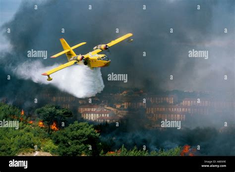 Firefighting aircraft over Marseille city battling wildfire spread