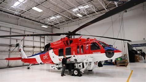 firehawk helicopter being loaded with medical equipment during disaster response