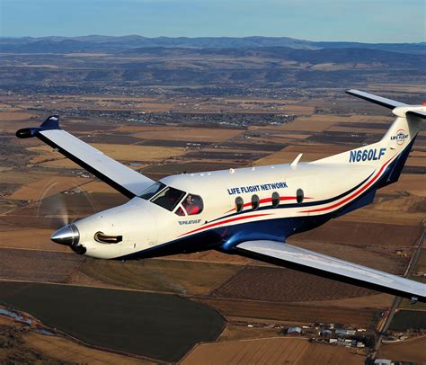 fixed-wing plane above Emerald Coast shoreline