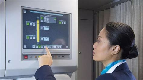 flight attendant monitoring cabin during inflight service