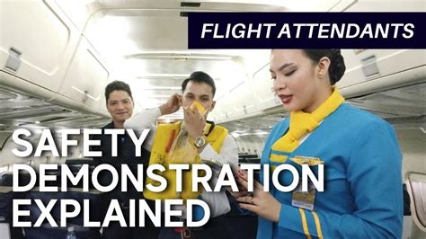 flight attendants conducting safety demonstration on long haul international flight