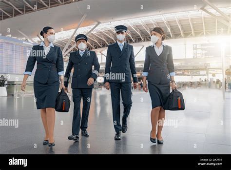 flight attendants walking through international airport on long haul assignment