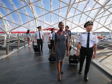 flight attendants walking together through a city during an international layover