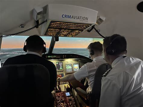 flight crew undergoing crm training session in simulator