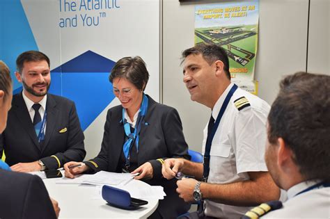 flight instructors discussing compliance requirements in pre-flight briefing room