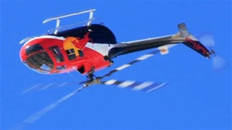 flying bulls bo-105c helicopter in inverted flight during airshow