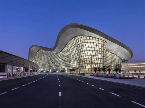 Flynas and Etihad aircraft parked at adjacent gates at Abu Dhabi airport