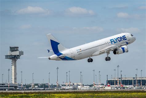 flyone and hissky aircraft on chișinău airport tarmac with passengers boarding