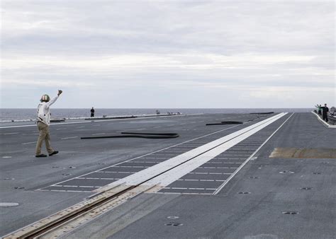 Ford class aircraft carrier EMALS electromagnetic launch system flight deck