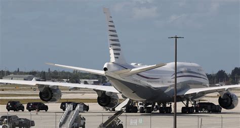 former qatar air boeing 747 tail parked in usa with new markings