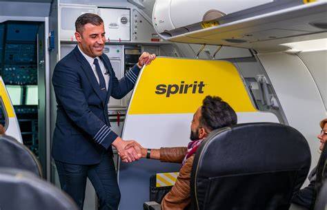 former Spirit Airlines pilots in uniform walking through an airport terminal after Spirit shutdown