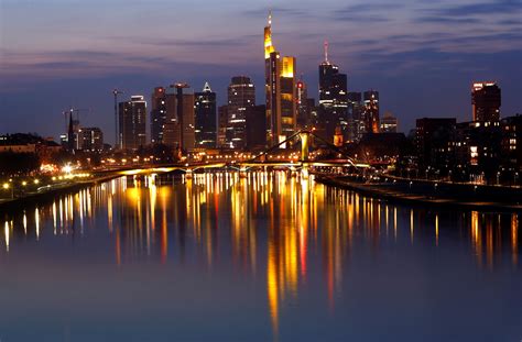 frankfurt city skyline during evening seen from train window
