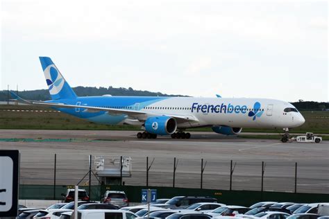 French bee A350-1000 taxiing at Newark under golden sunset skies