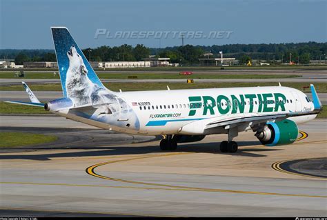 frontier a320 taking off at atlanta airport with caribbean route banners