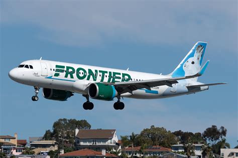 frontier a320neo descending over sint maarten’s famous maho beach