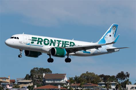 frontier airbus with animal tail art taxiing in denver