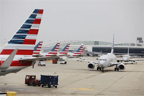 frontier aircraft at miami airport tarmac with latin america destinations signage