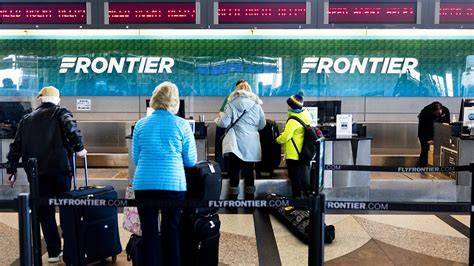 frontier airlines check-in desk with angry passengers
