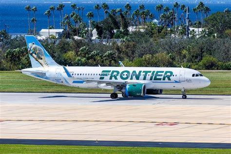 Frontier Airlines gate signage announcing new route launch