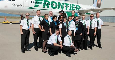 frontier airlines team celebrating earth day with sustainable aircraft messaging