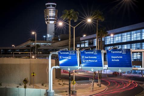 Frontier flight departing from Phoenix Sky Harbor with sunset backdrop