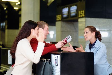 frustrated passengers dealing with strike delay at check-in desk