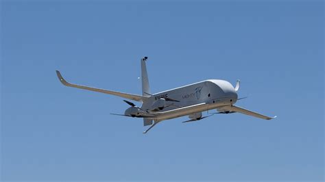 future aircraft support technician working on autonomous flight systems in advanced hangar