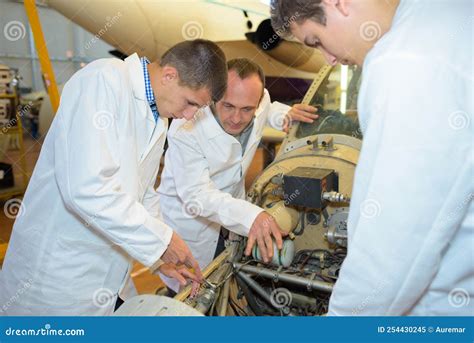 GE Aerospace engineers collaborating in engine testing area