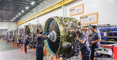 GE Aviation MRO team servicing jet turbine in specialized clean room