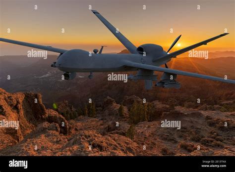 general atomics mq-9 reaper flying over desert terrain